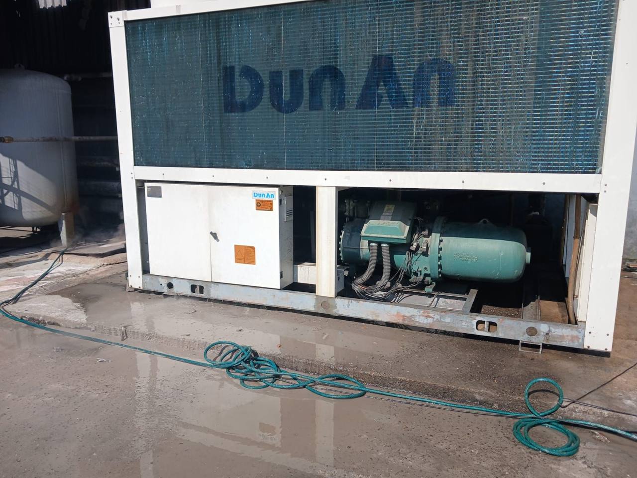 Close-up inspection of a chiller compressor unit